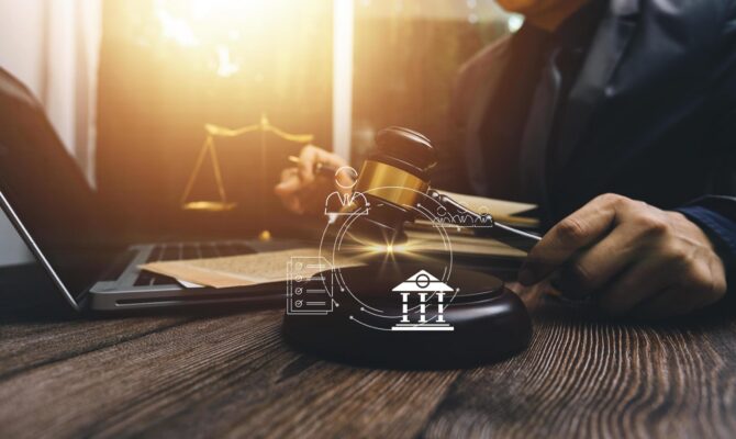 justice-and-law-concept-male-judge-in-a-courtroom-on-wooden-table-and-counselor-or-male-lawyer-working-in-office-legal-law-advice-and-justice-concept-free-photo